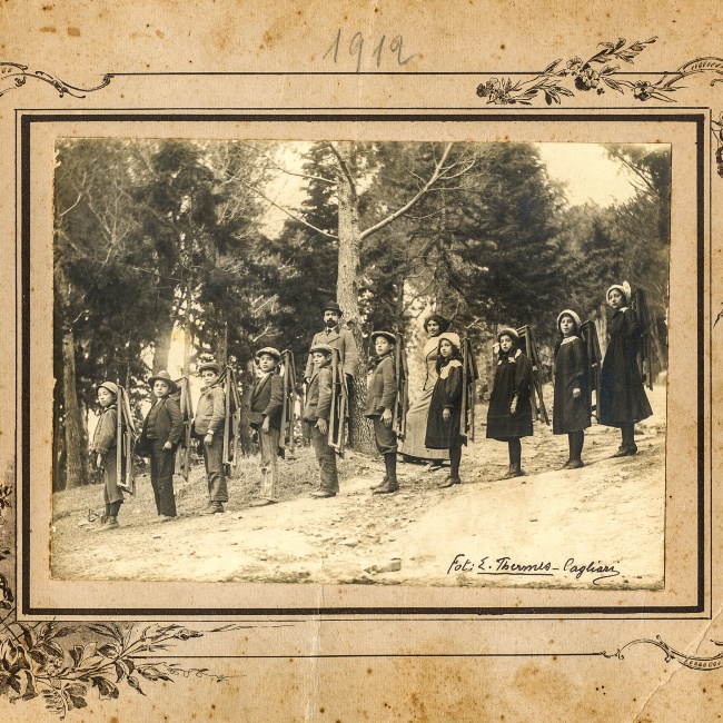 Vintage photo of boys in the pine forest